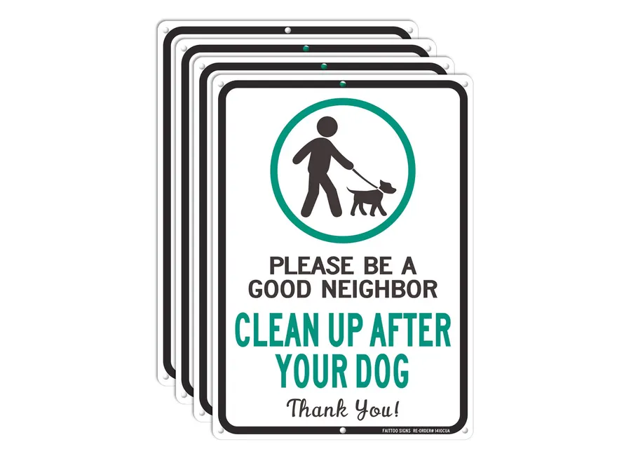 Dog waste station sign reminding residents to clean up after dogs